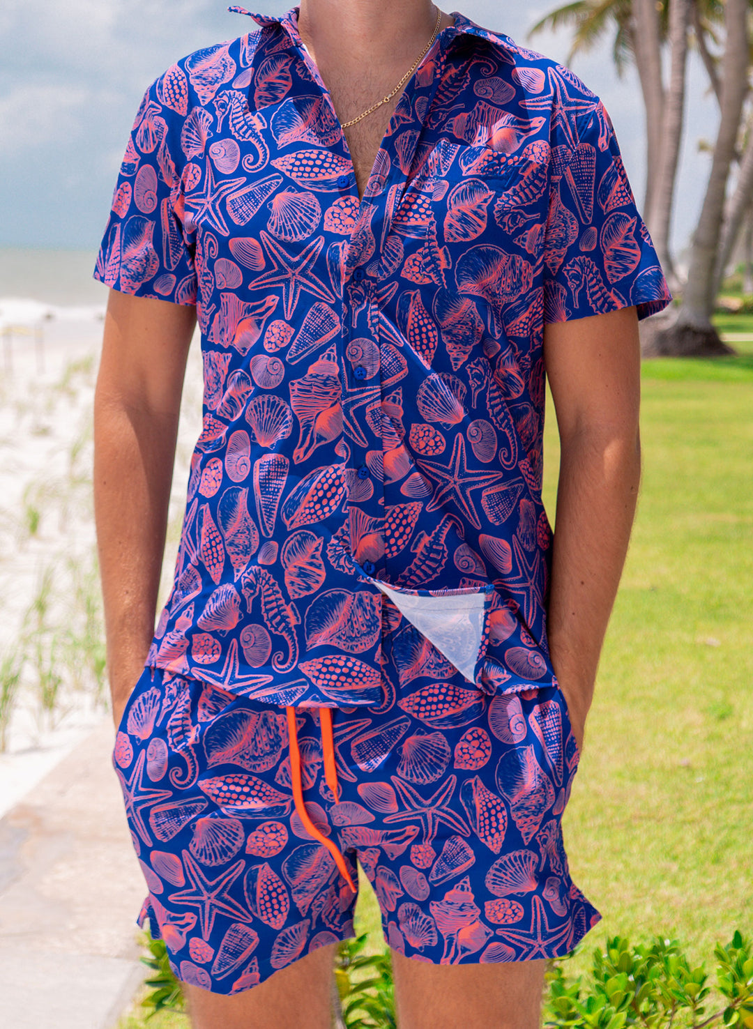 Salty Mermaid Neon Drift men’s bathing suit set – blue and coral seashell print swim trunks and matching shirt