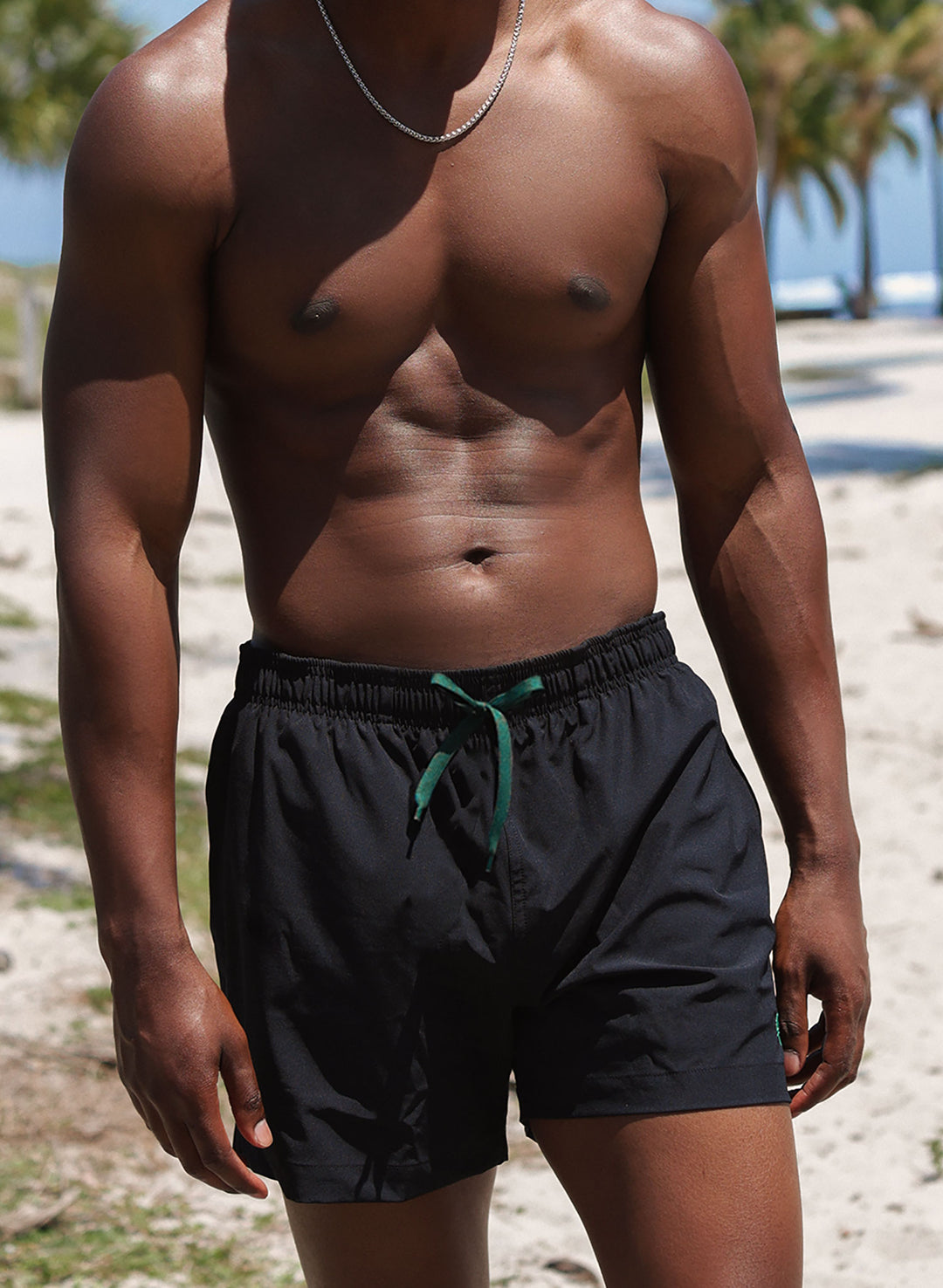 Men’s solid black 5" inseam swim trunks, drawstring waist, beach fit—Salty Mermaid