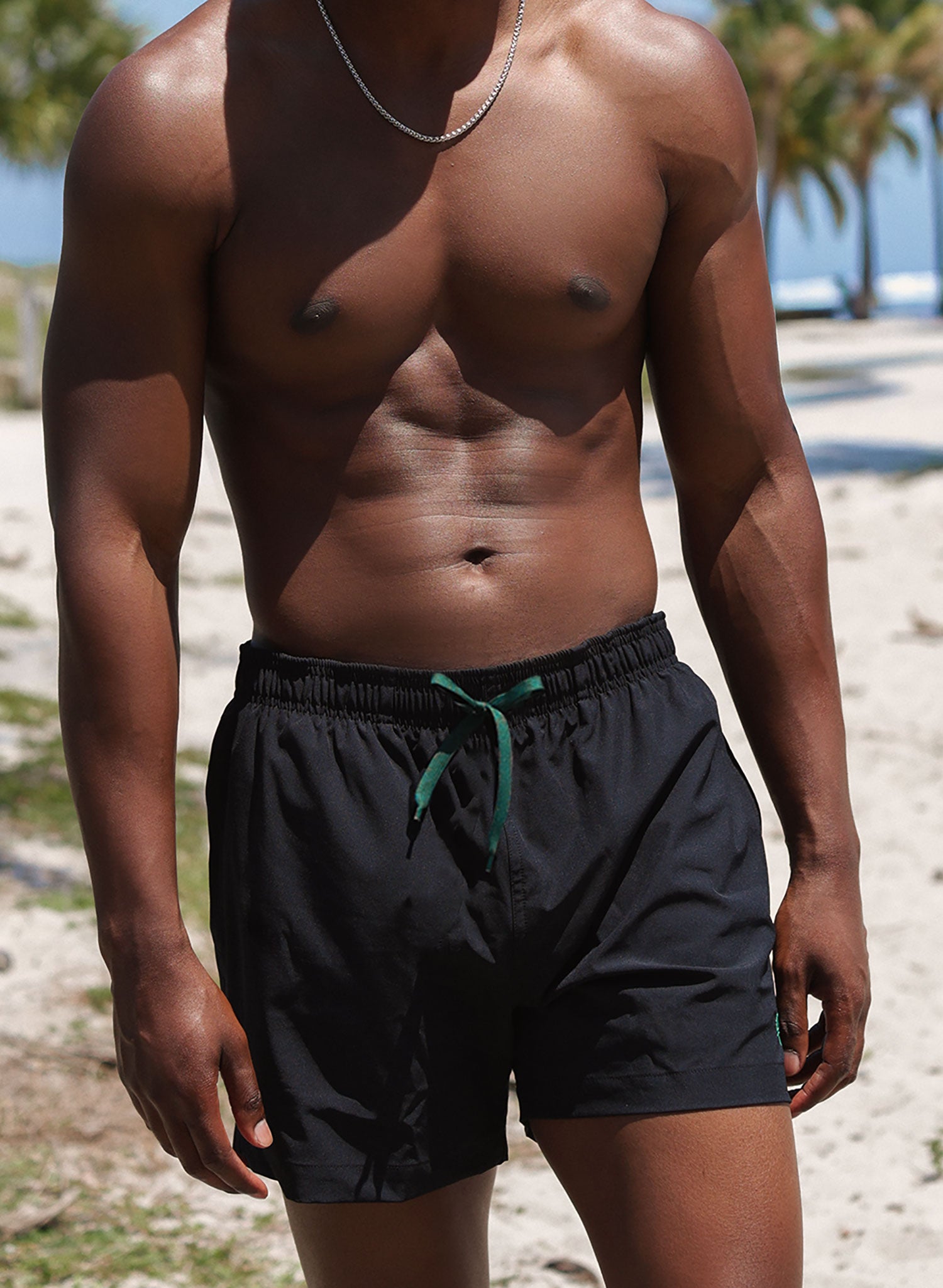 Men’s solid black 5" inseam swim trunks, drawstring waist, beach fit—Salty Mermaid