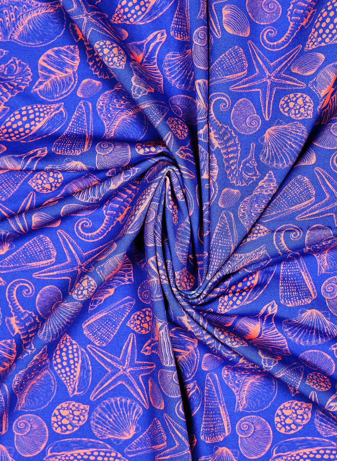 Women's Bathing suit print with Seashell and seahorse print featuring coral pink marine life illustrations on a deep ocean blue background, with starfish, scallops, spiral shells, and seahorses in a coastal beach pattern.