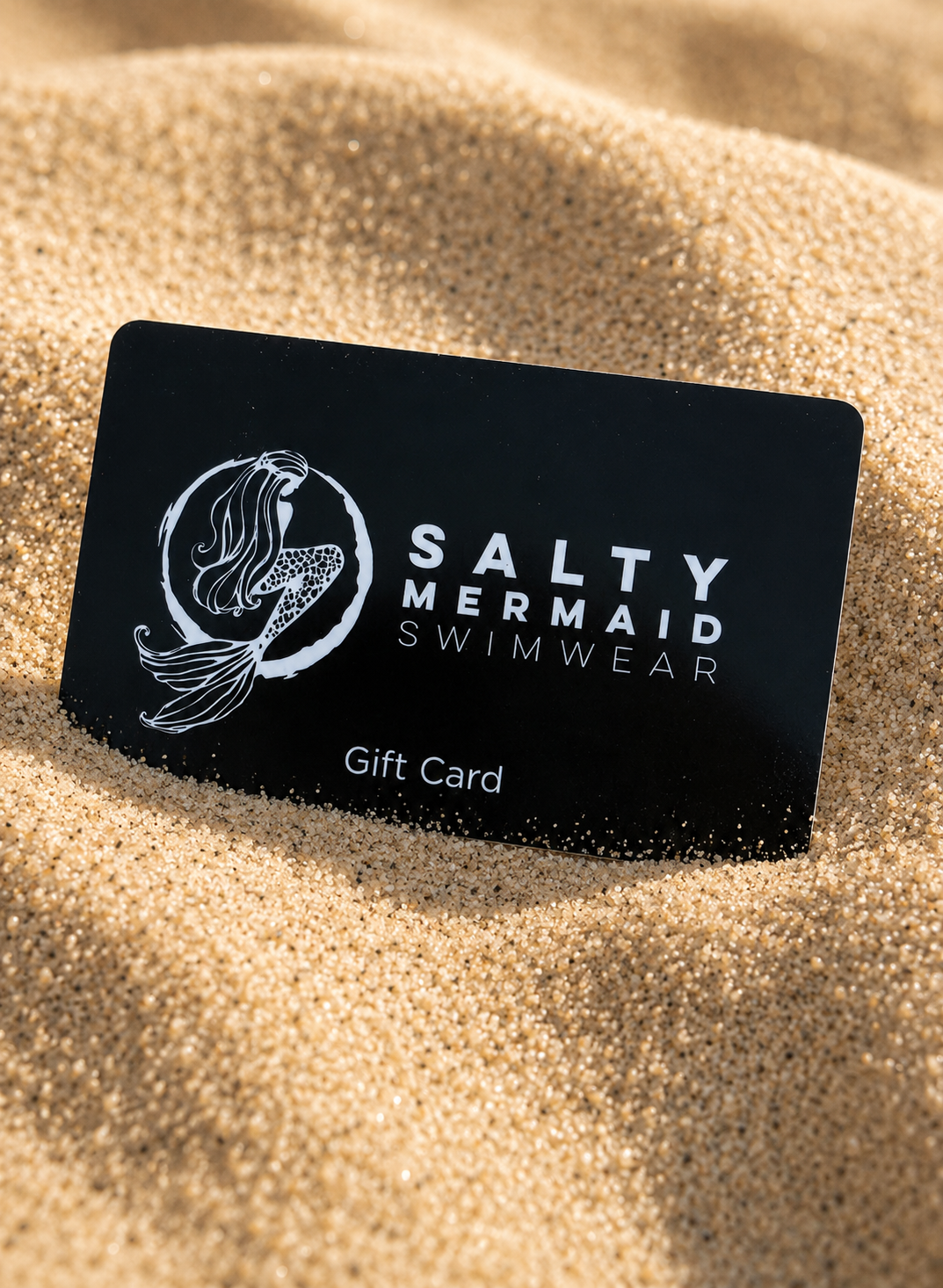 Black Salty Mermaid Swimwear gift card on sand