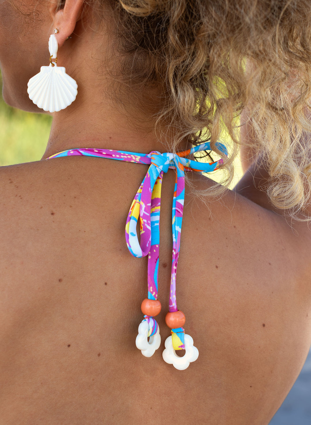 Playful tie-back detail with flower beads—Hot Tropic bikini top, Salty Mermaid
