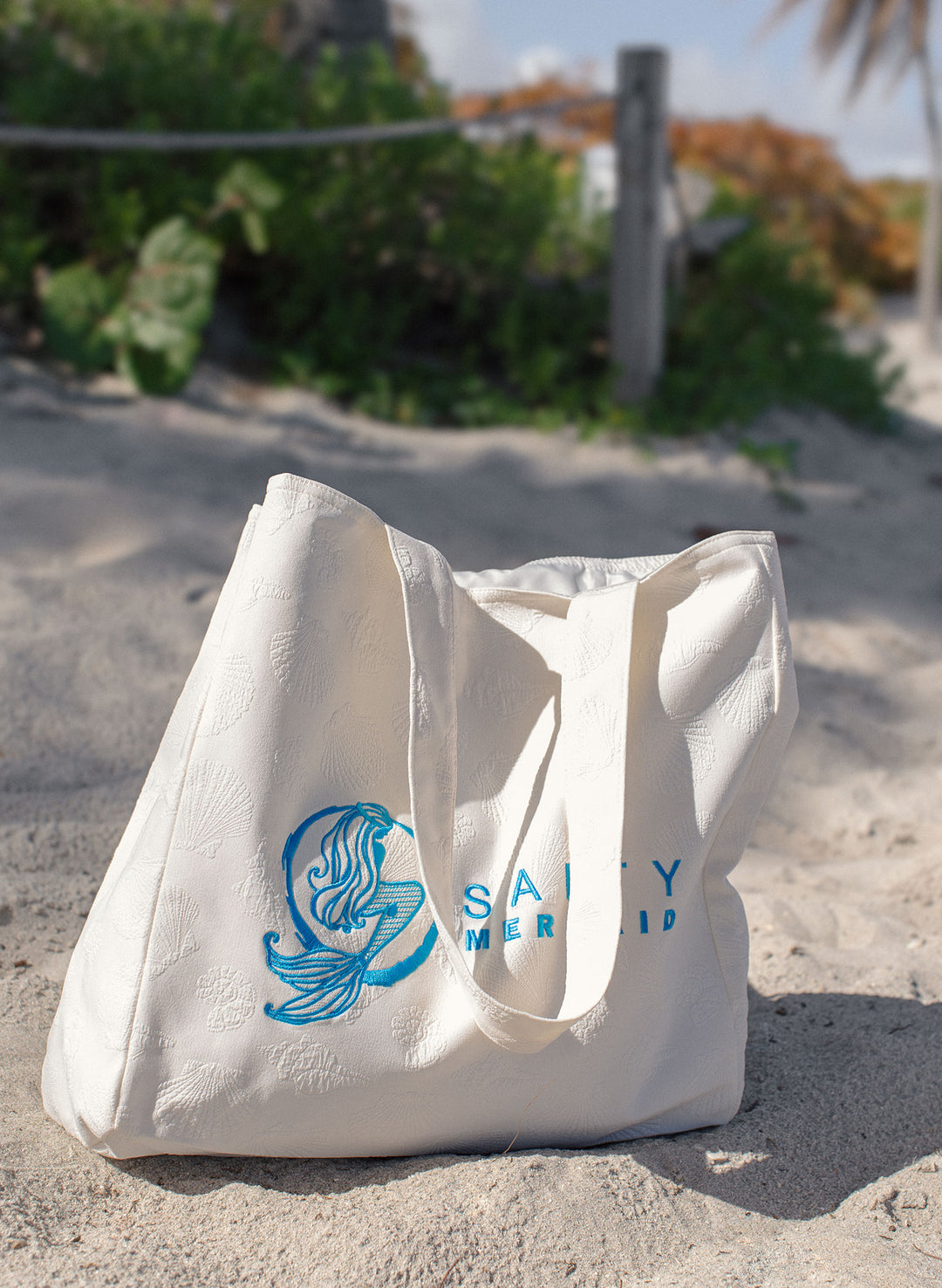 Resort beach tote in textured seashell print in ivory color, oversized and ready for summer travel crafted by salty mermaid swimwear