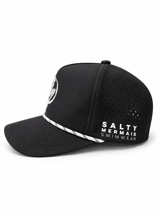 Side view of Salty Mermaid black golf hat showing teardrop perforations, white brand lettering, and nautical rope above the brim.
