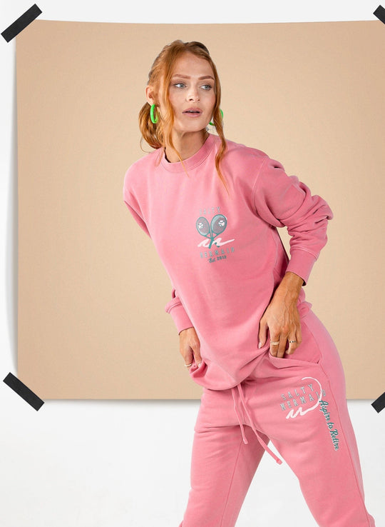 Women’s pink oversized crewneck sweatshirt and matching jogger set by Salty Mermaid with tennis club graphic