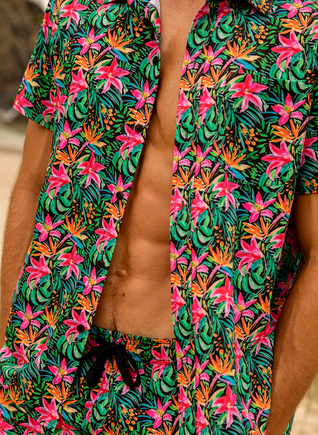 Close up of Island Bloom tropical floral print button down shirt by Salty Mermaid Swim men's matching swimwear sets