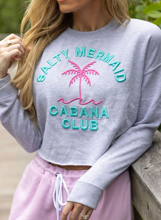Salty Mermaid Cabana Club cropped hoodie close up with embroidered design