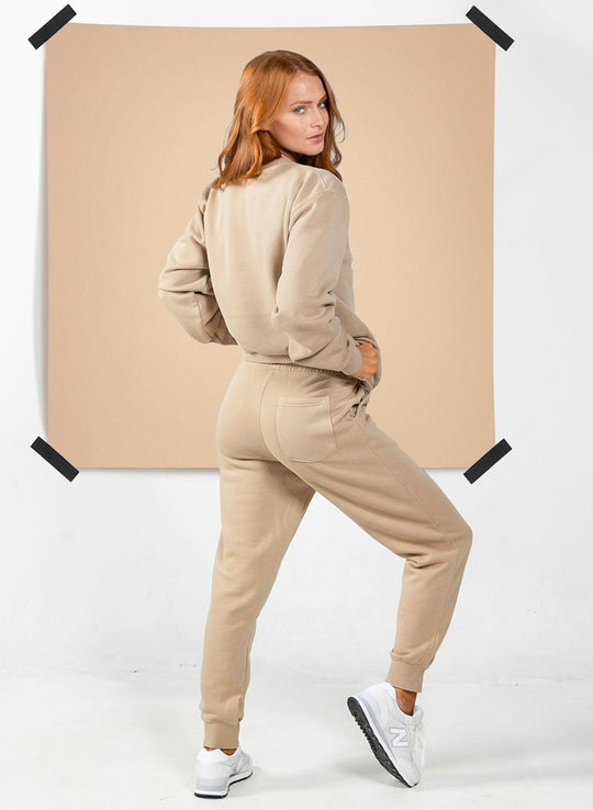 Women’s sandstone tan sweatshirt and matching jogger set by Salty Mermaid with relaxed fit and back pocket detail
