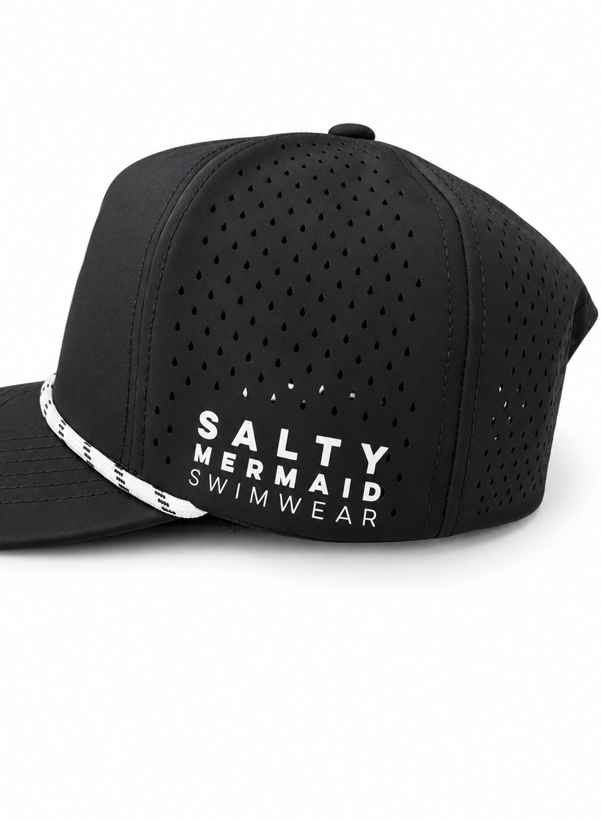 Close-up of Salty Mermaid black golf hat with teardrop ventilation holes, white SALTY MERMAID SWIMWEAR lettering, and rope trim.
