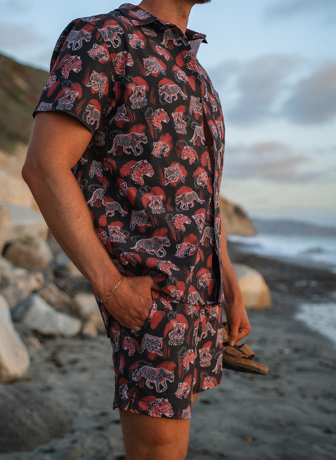 Salty Mermaid Men’s matching black swim trunk set with leopard and palm leaf print with matching button-down short sleeve shirt 