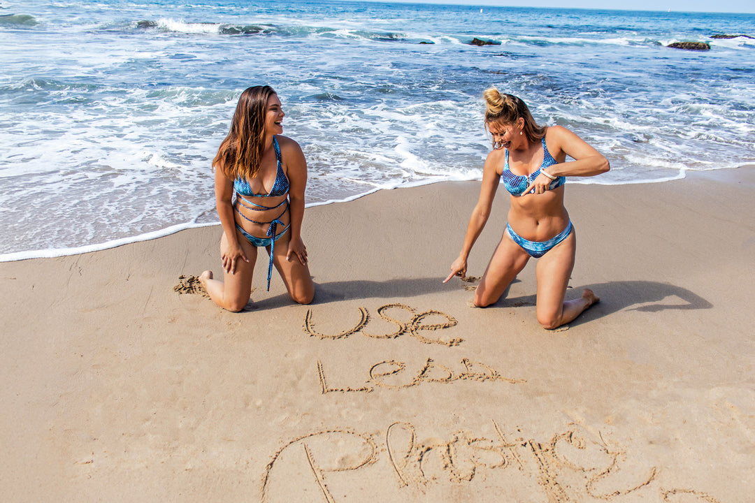 Salty Mermaid sustainable swimwear lifestyle image promoting ocean conservation, beach cleanup awareness, and eco-friendly swimwear values