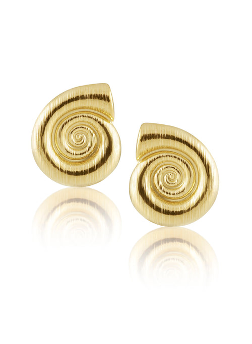 A pair of sahira ingrid gold spiral stud earrings with a brushed metallic texture, displayed on a clean white background with a soft reflection below.