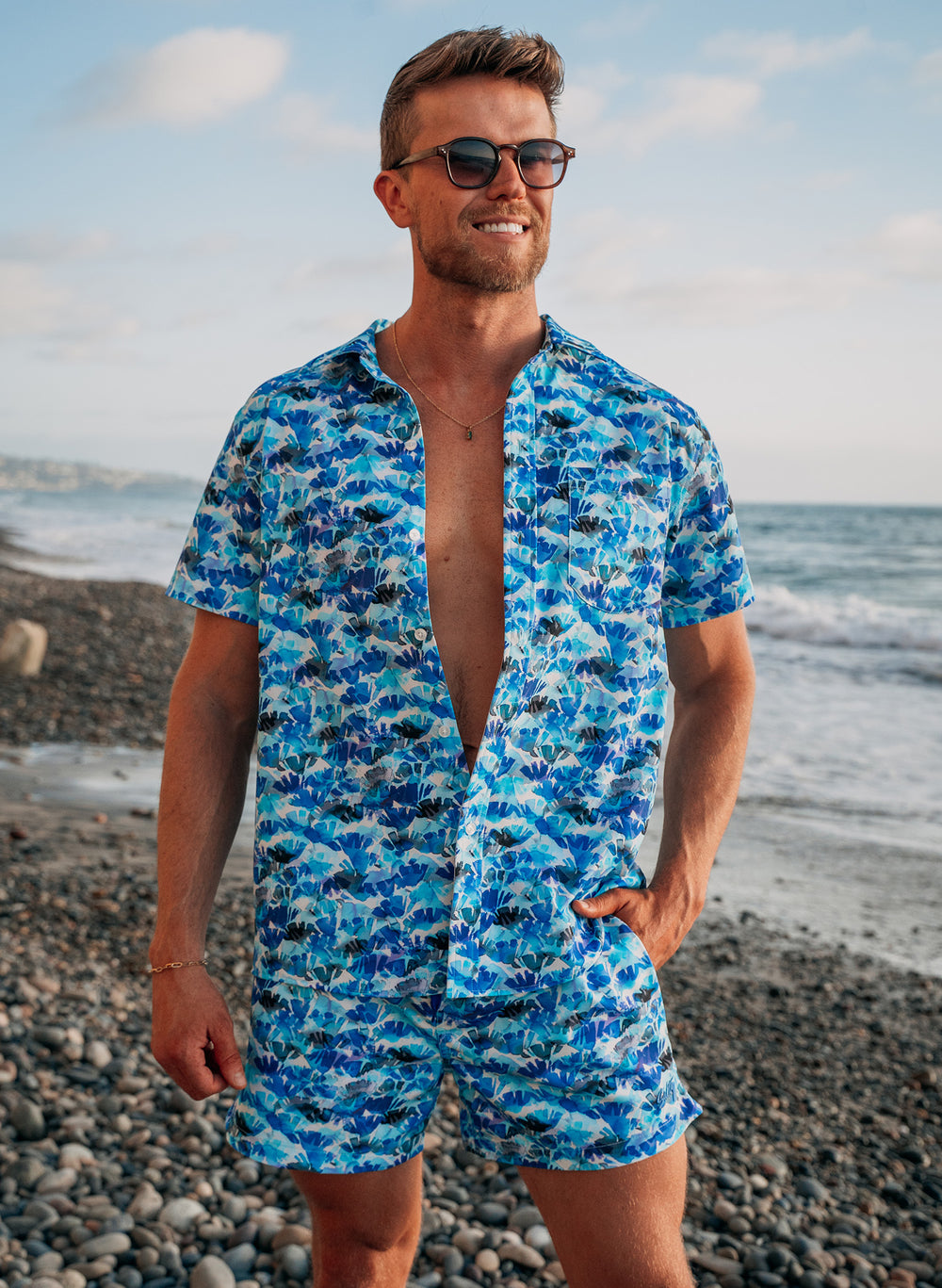 men's matching beachwear sets by salty mermaid. Saltwater petals matching set featuring abstract wave print with hues of blue and white. 