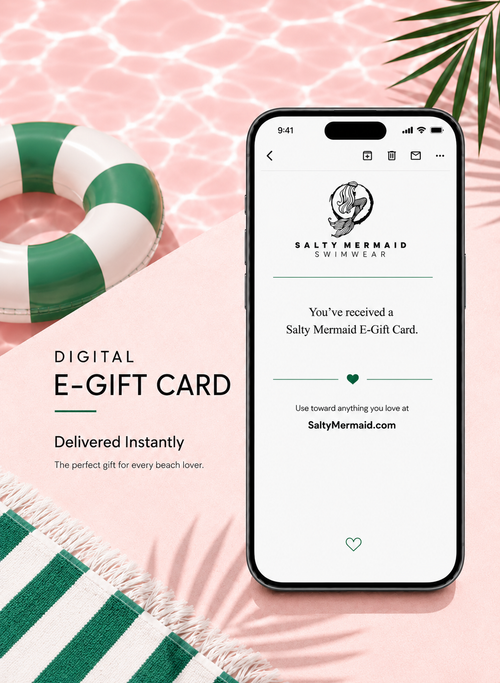 Phone displaying a digital e-gift card for Salty Mermaid Swimwear on a pink background with a pool float and towel.